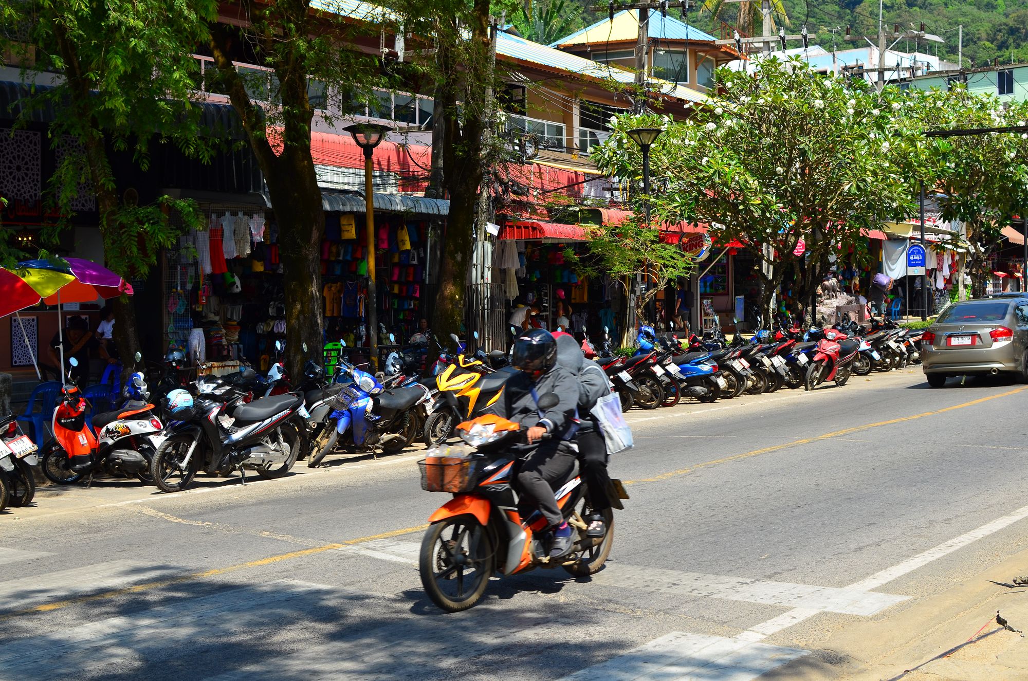 Shops and motor scooters in Krabi